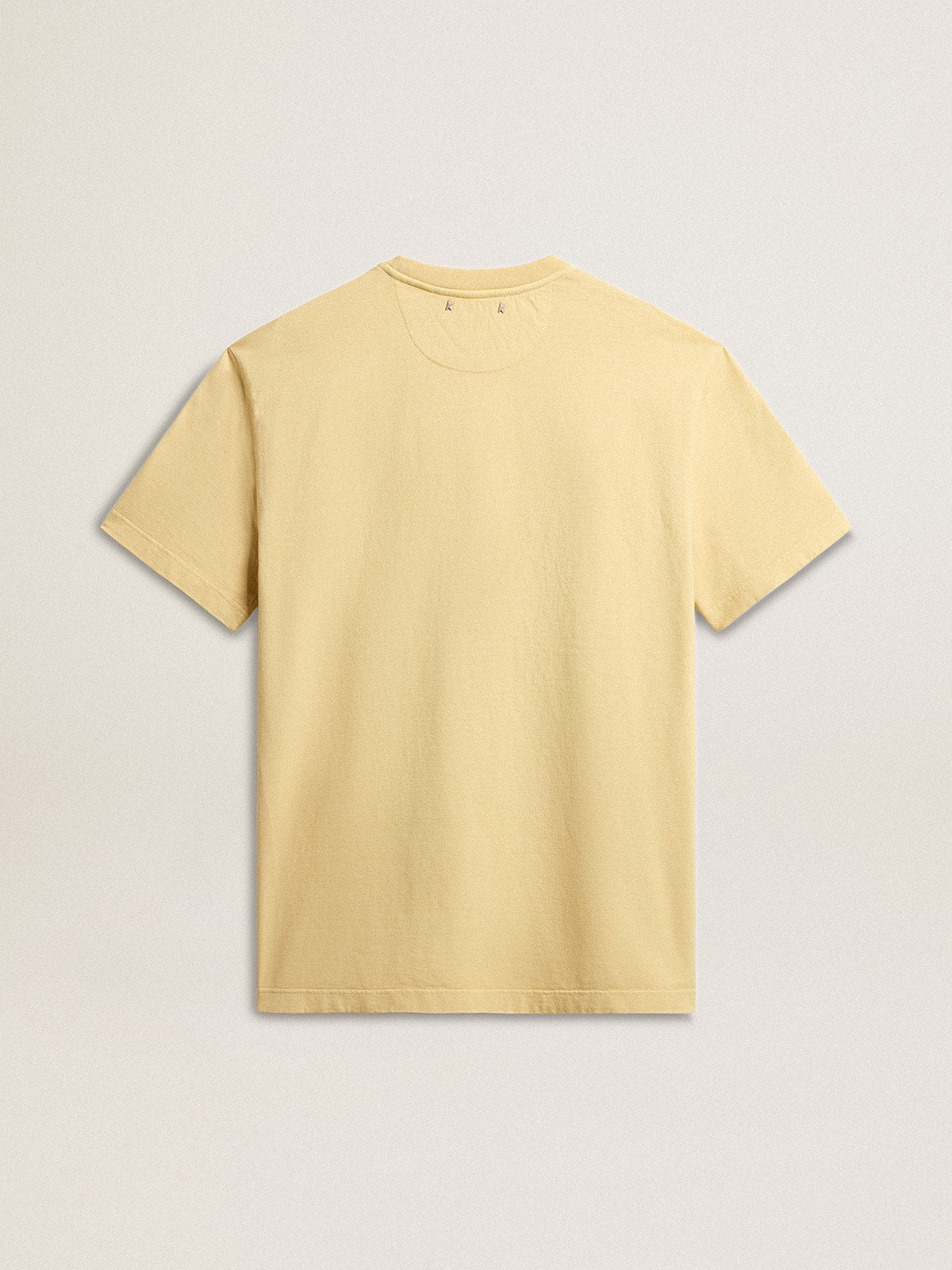 Men's cotton T-shirt in pale yellow with faded lettering